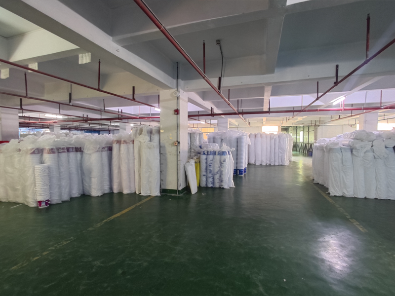 Finished goods warehouse with packaged plastic buckets ready for export